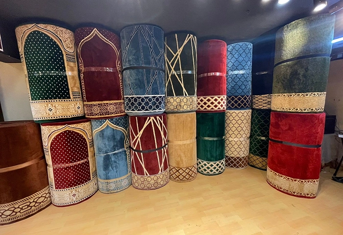 Bulk order of 4-meter acrylic mosque carpets being prepared for export by Pamcha