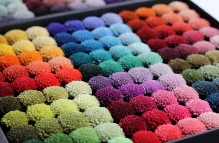 Close-up of thick acrylic yarn used in machine-made mosque carpet